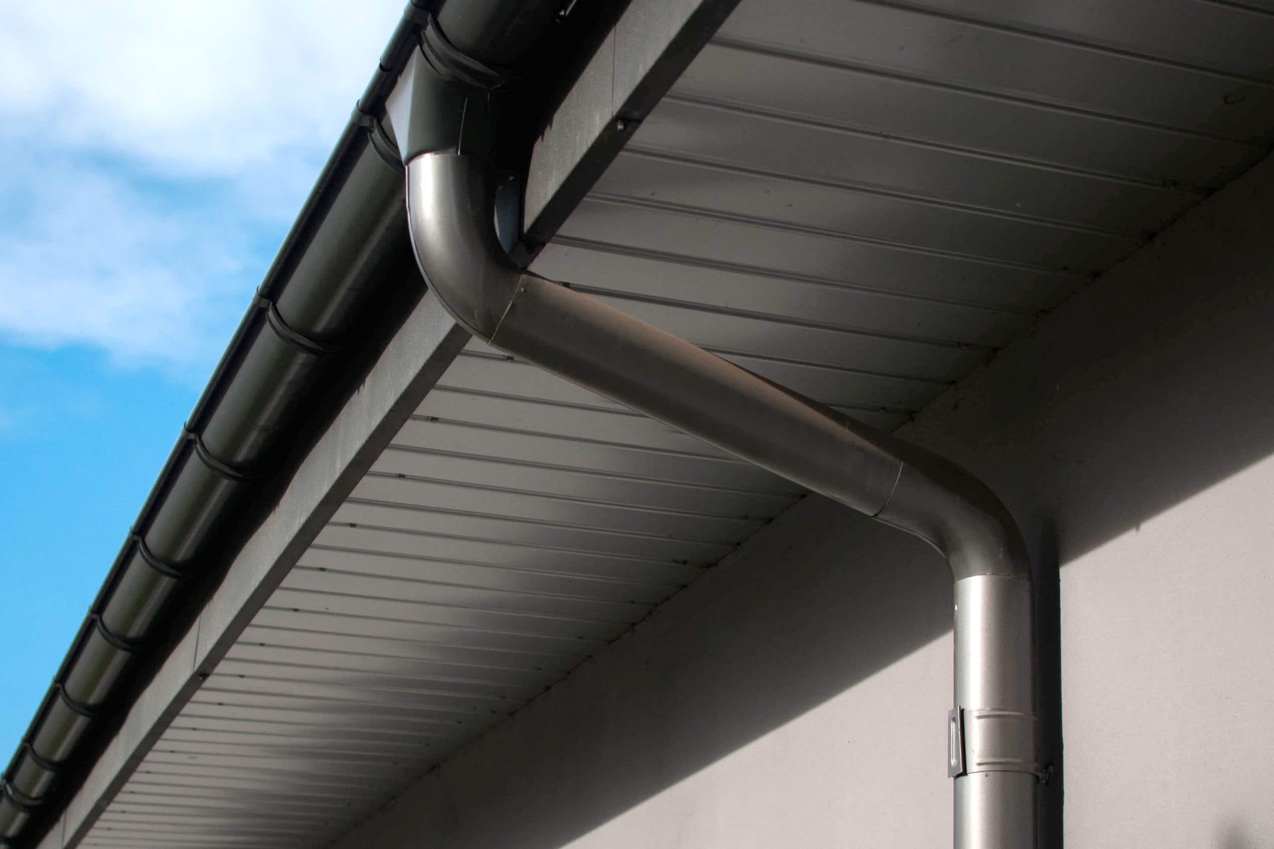 Corrosion-resistant galvanized gutters installed on a commercial building in Fayetteville